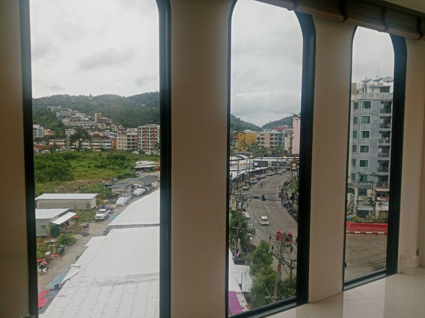 Floor-to-ceiling condo glass filmed with a Patong city view kept crystal clear