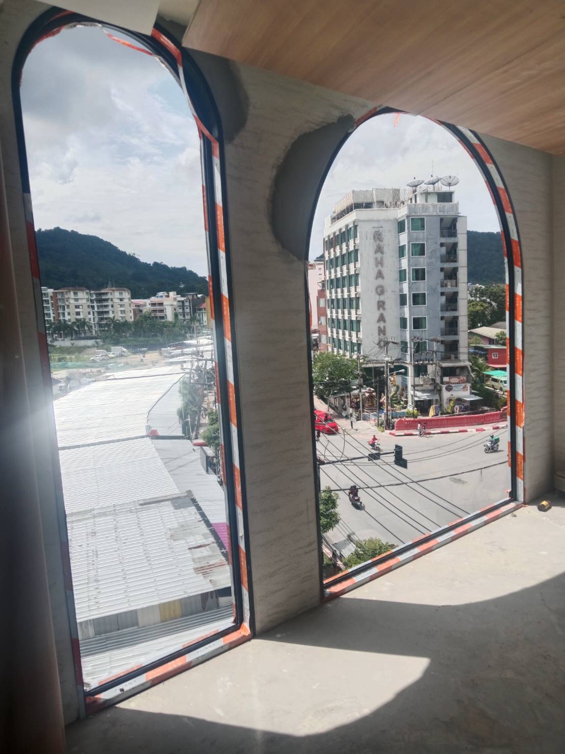 JaiDeeClear heat and UV window film on floor-to-ceiling high-rise condo glass with a Patong city view, The Cube Amaze