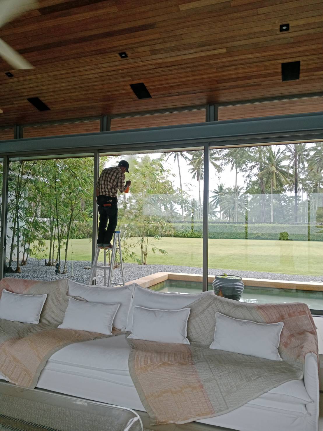Living-room glass filmed on a family home in Phuket, garden view kept clear