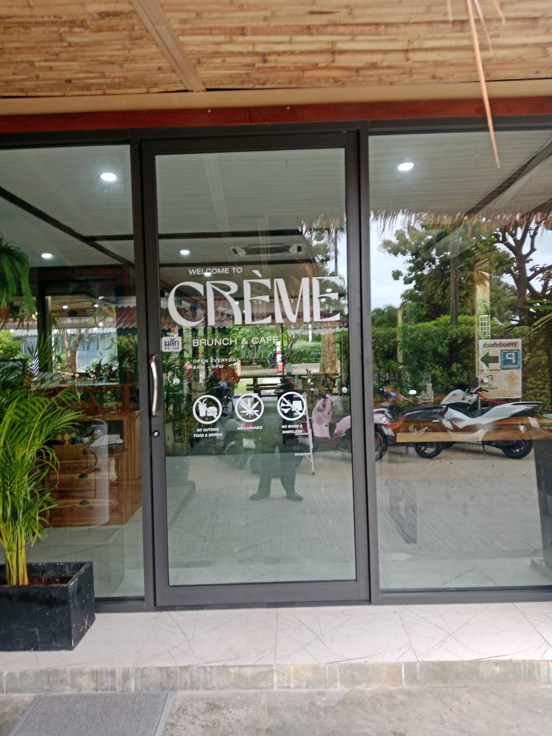 Window film on the storefront glass at CRÈME Brunch & Café, Phuket