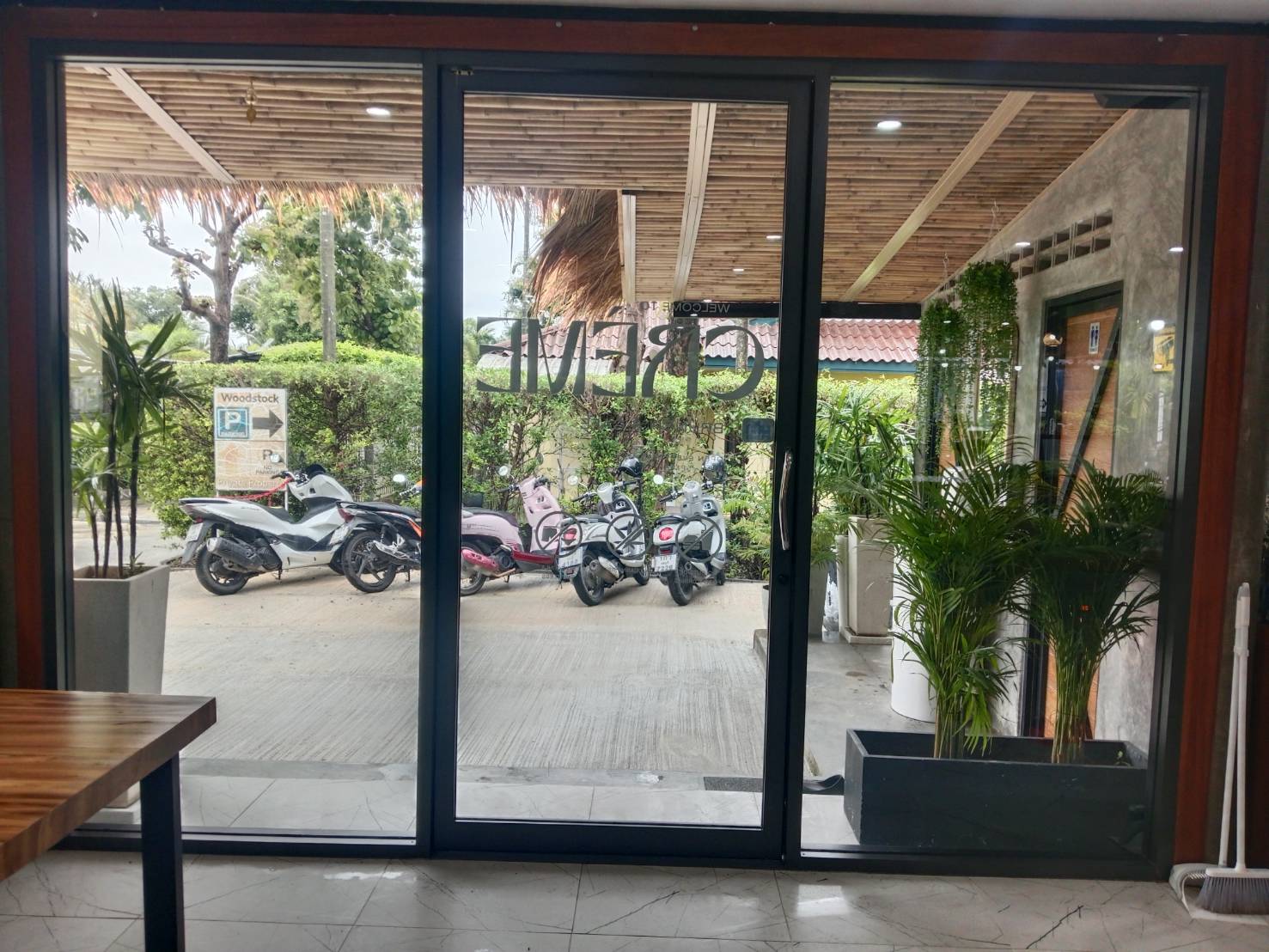 Street-level shopfront glass filmed at ground level in Phuket